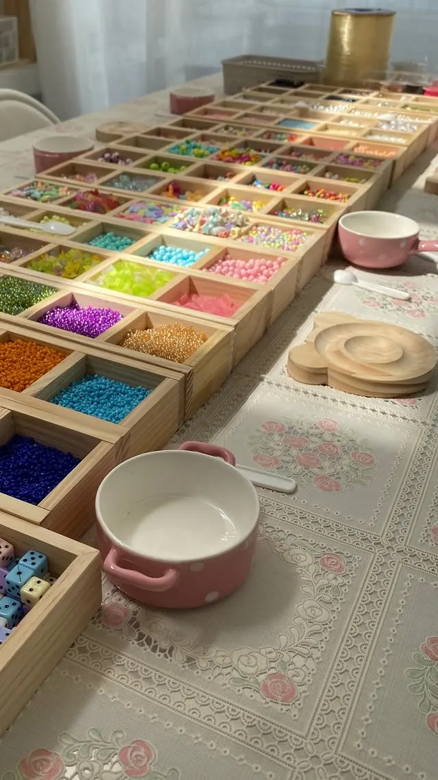 Charm bead trays on the workshop table